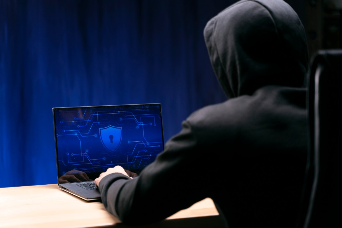 Person checking phone for suspicious SMS